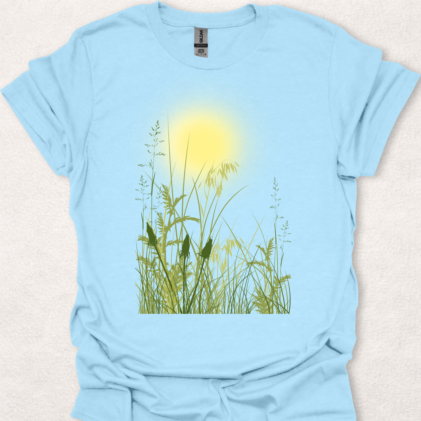 Sunlit Meadow nature-inspired t-shirt in light blue.